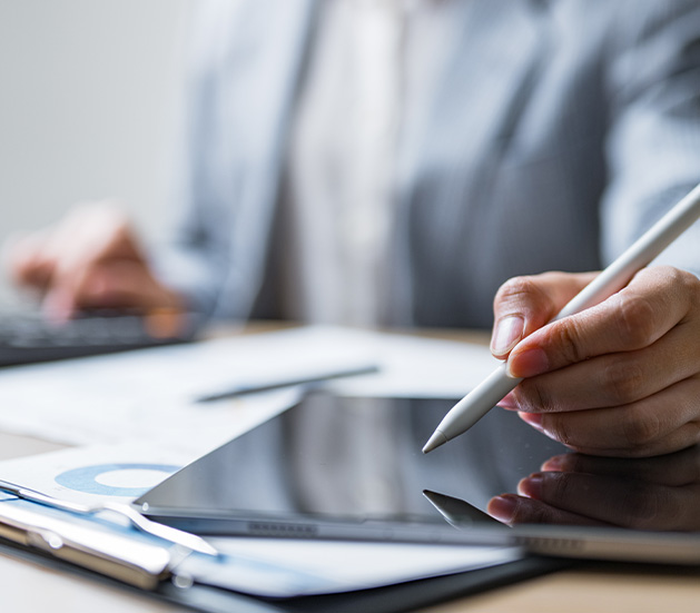 woman in a laboratory using tablet device with industrial equipment in background focusing on research and development important for scientific studies and advancements in technology 4 innovative solutions